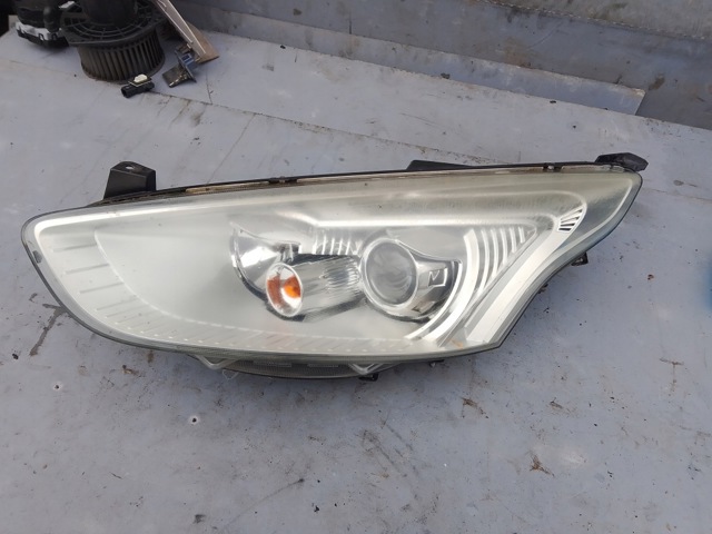 Фара ліва передня AV1113W030CD FORD