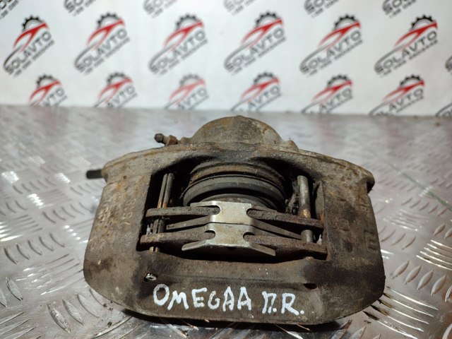 Супорт гальмівний, передній, правий 90421745 OPEL