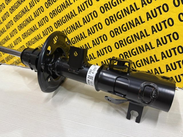 Амортизатор передньої підвіски KB8M34700 MAZDA