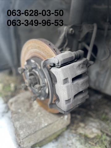 Супорт гальмівний, передній, лівий 41011WA200 NISSAN