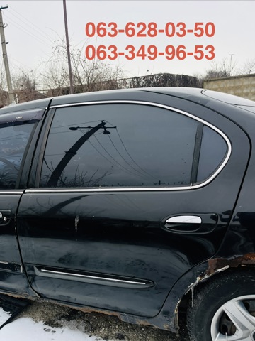 Скло заднє ліве 823012Y263 NISSAN