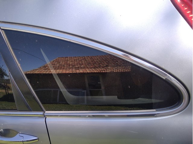 Скло-кватирка двері, задній, лівою 73561SWWE01 HONDA