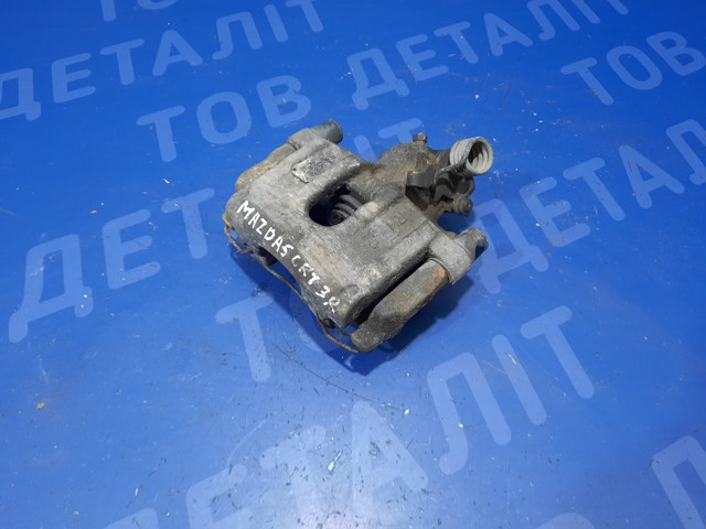 Супорт гальмівний задній правий CCY92661X MAZDA