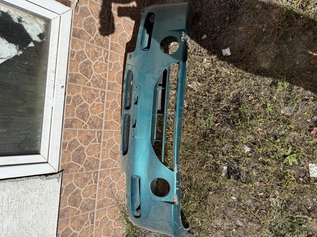 Бампер передній Mazda 323 BA
