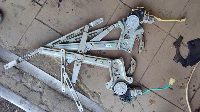 Мотор склопідйомника дверей передніх, лівих 1452803 FORD