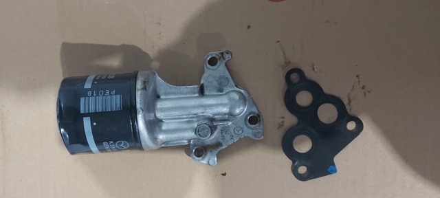 Корпус масляного фільтра PE0114311 MAZDA