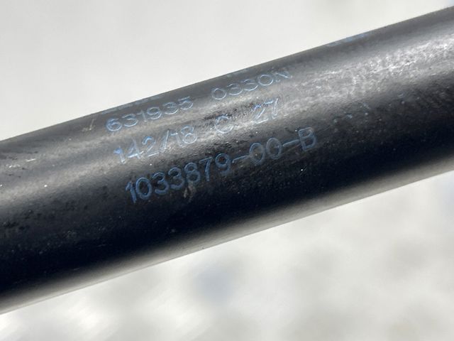 Опора капота ліва 103387900B TESLA
