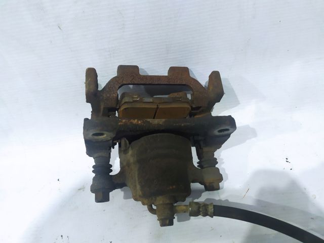 Супорт гальмівний задній правий 440011AA0A NISSAN