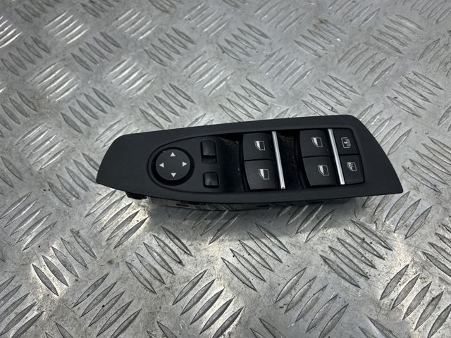 Кнопки переднього лівого склопід'ємника 61319241915 BMW