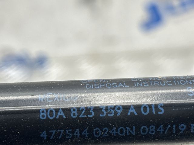 Амортизатор капота газовий 80A823359A VAG