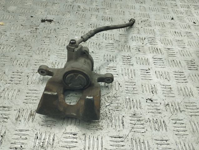 Задній гальмівний супорт лівий 8W0615403 VAG