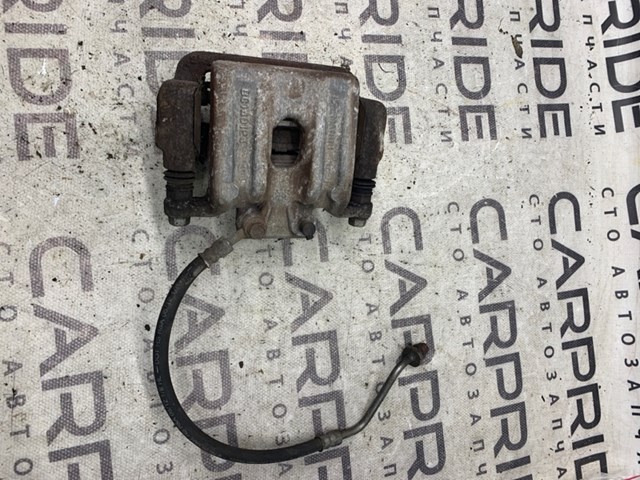 Задній гальмівний супорт лівий 582100W000 HYUNDAI