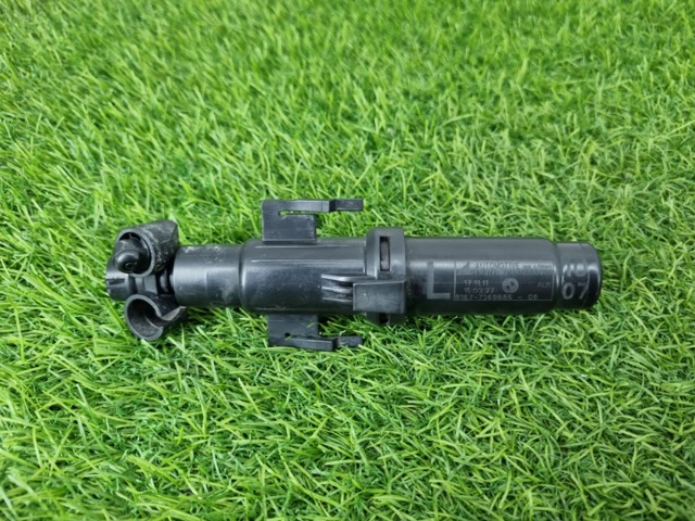 Форсунка омивача фари передньої, лівої 7149885 BMW