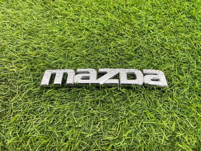 Фірмовий значок на кришку багажника GJ6A51711 MAZDA