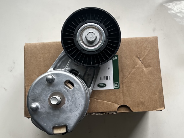 Натягувач приводного ременя LR035546 LAND ROVER