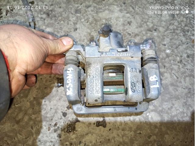 Задній гальмівний супорт лівий 582103Q100 HYUNDAI