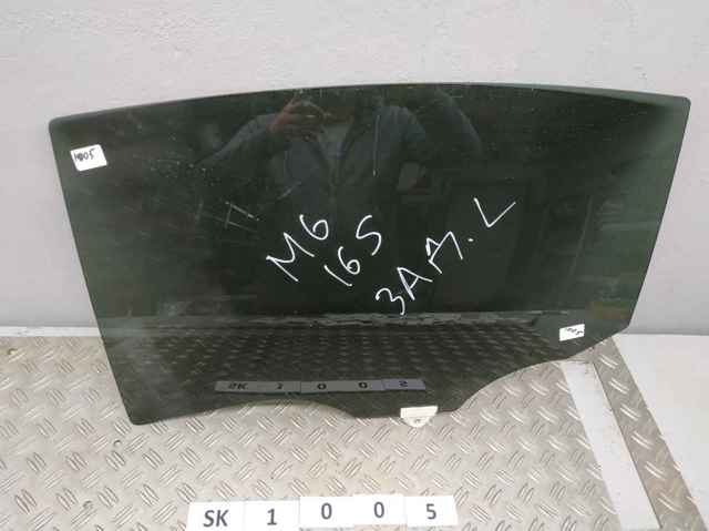 Скло задньої двері лівої GHK573510A MAZDA