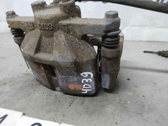 Супорт гальмівний, передній, лівий K0Y13399Z MAZDA