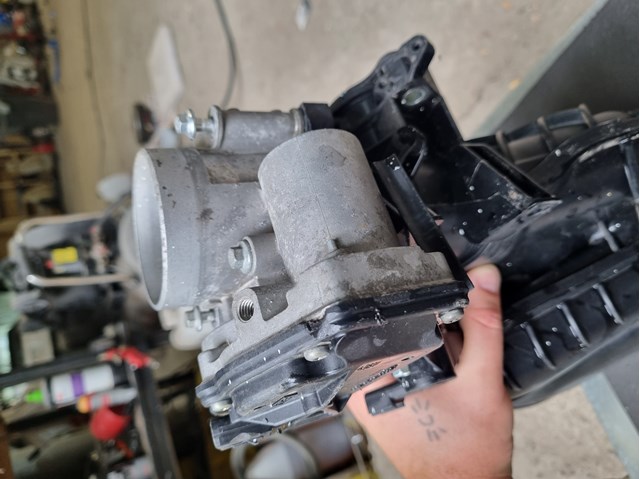 Дросільна заслінка в зборі 04891970AB CHRYSLER
