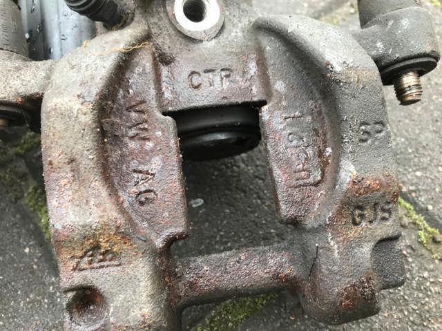 Задній гальмівний супорт лівий 3Q0615405 VAG