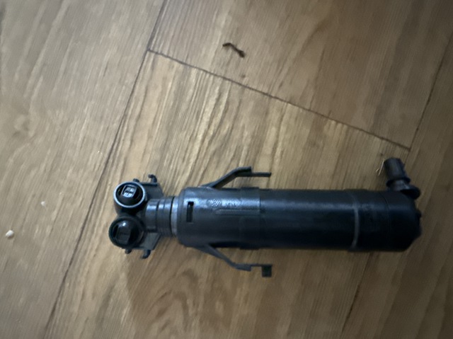 Форсунка омивача фари передньої, лівою 1T0955103B VAG