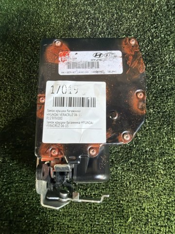 Замок, ручка і привід (багажника) 812303J100 HYUNDAI