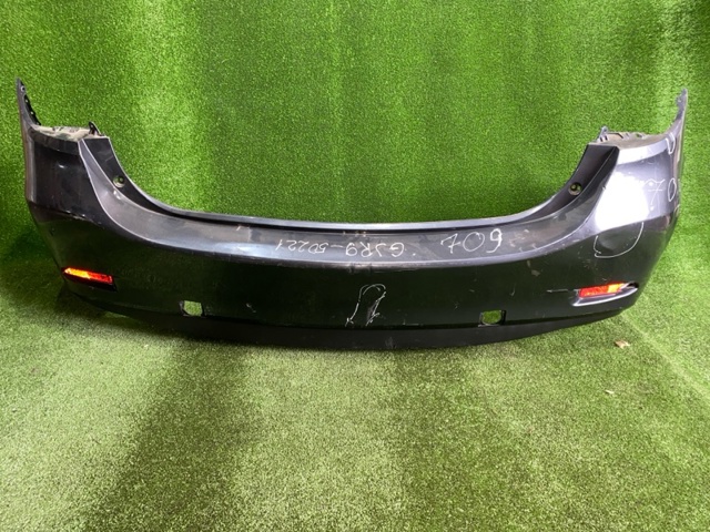 Буфер (бампер) задній GJR950221 MAZDA