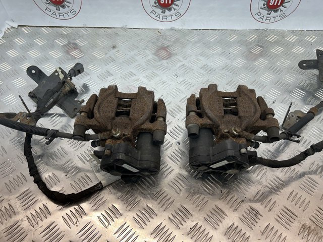 Задній гальмівний супорт лівий DG9Z2553C FORD