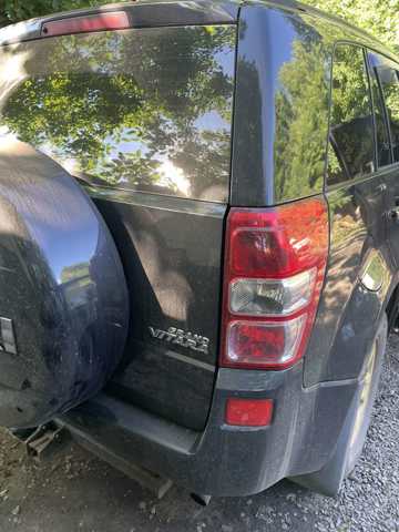 Кожух бампера заднього 7181165J10799 SUZUKI