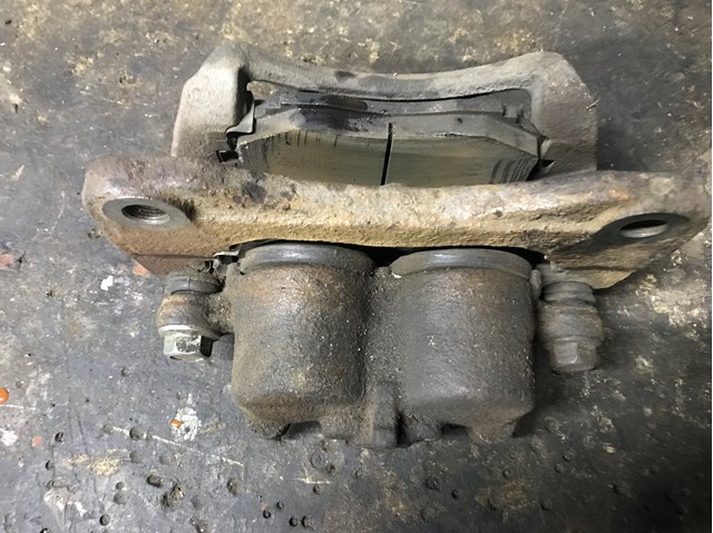 Супорт гальмівний, передній, лівий LC623371X MAZDA