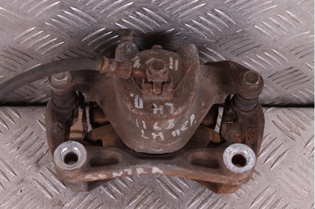 Супорт гальмівний, передній, лівий 41011ET00A NISSAN