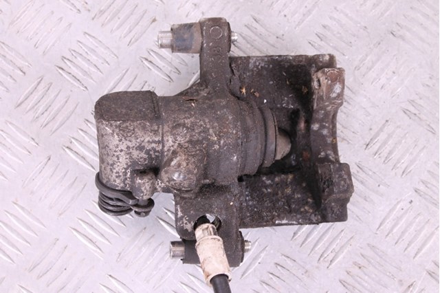 Супорт гальмівний задній правий 8M5Z2553L FORD