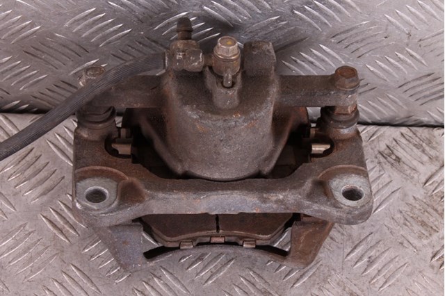 Супорт гальмівний, передній, лівий B4Y03399ZB MAZDA