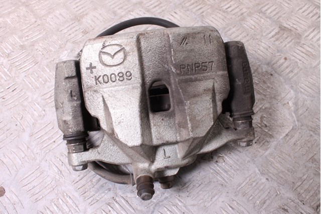 Супорт гальмівний, передній, лівий GHY93399Z MAZDA