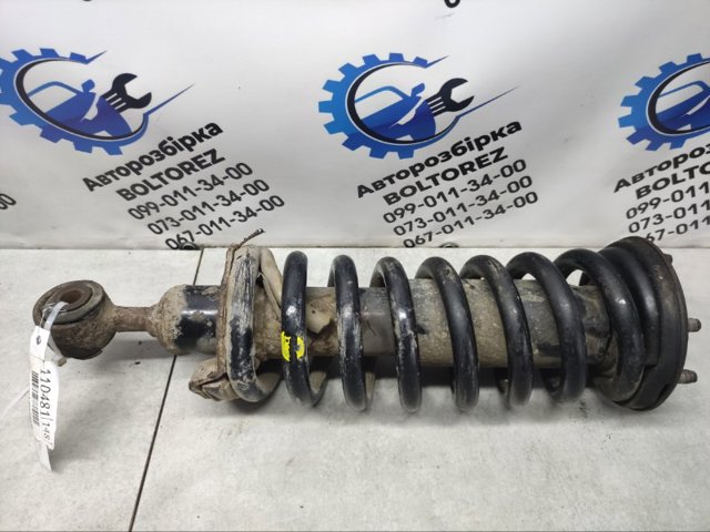 Амортизатор передньої підвіски 561005X07A NISSAN