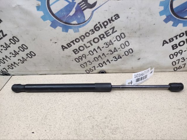 Амортизатор двері задньої 561827550B VAG