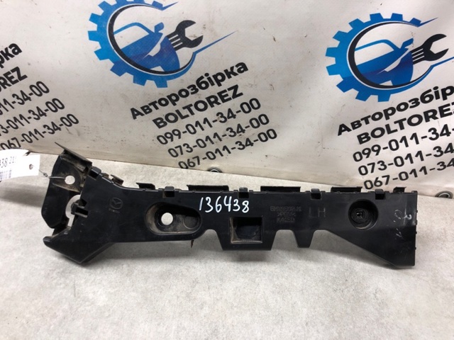 Кронштейн бампера заднього, зовнішній лівий BHN9502J1C MAZDA