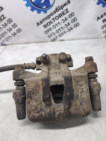 Задній гальмівний супорт лівий MN116309 MITSUBISHI