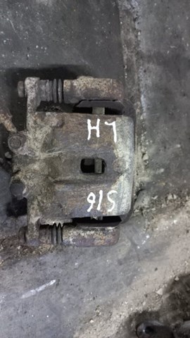 Задній гальмівний супорт лівий 583102PA70 HYUNDAI