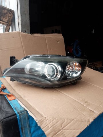 Фара основна ліва 84001FG310 SUBARU