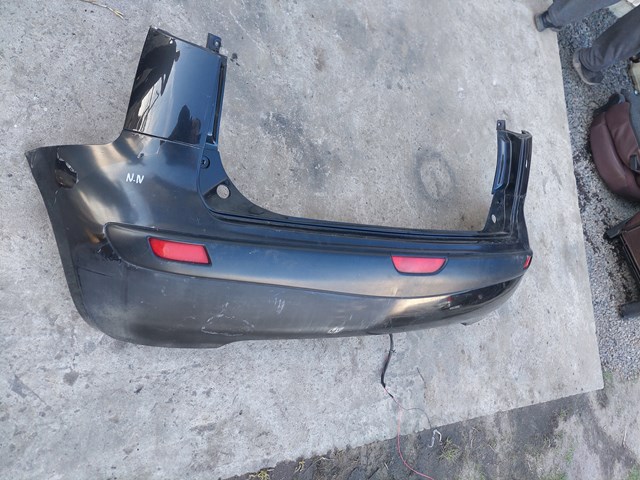Бампер задній 850229U040 NISSAN