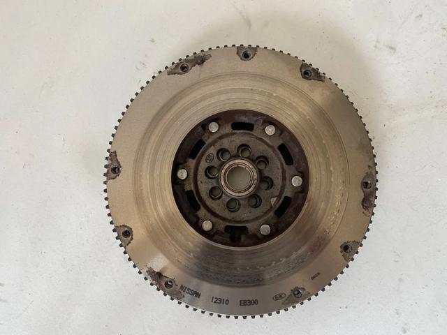 Маховик із зубчастим ободом в зборі 12310EB300 NISSAN