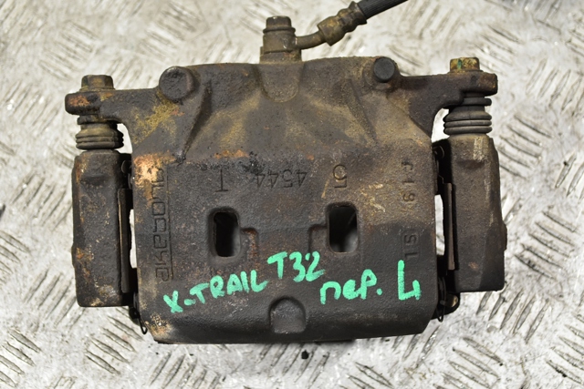 Супорт гальмівний, передній, лівий 410114GA0A NISSAN