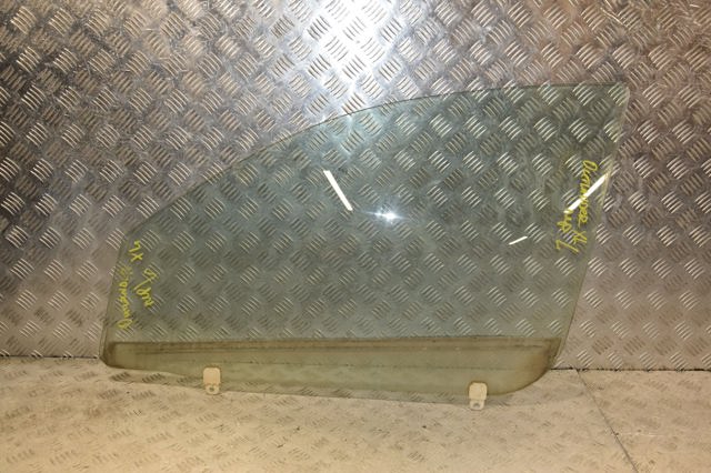 Скло водійських дверей 5706A007 MITSUBISHI