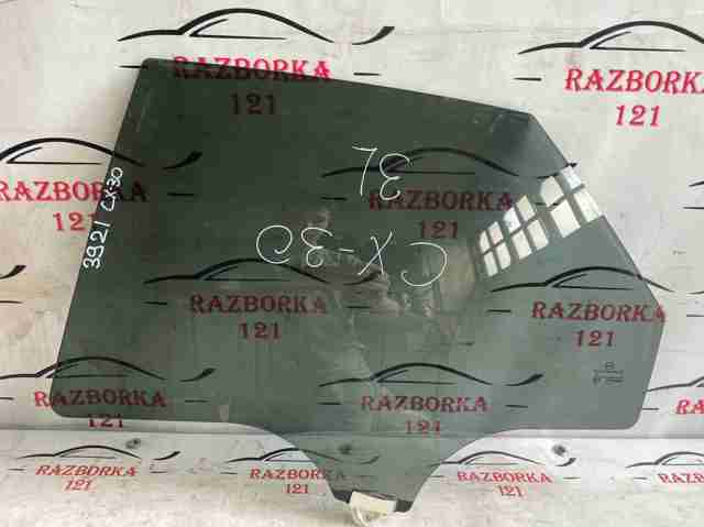Скло задньої двері лівої DFR773510A MAZDA