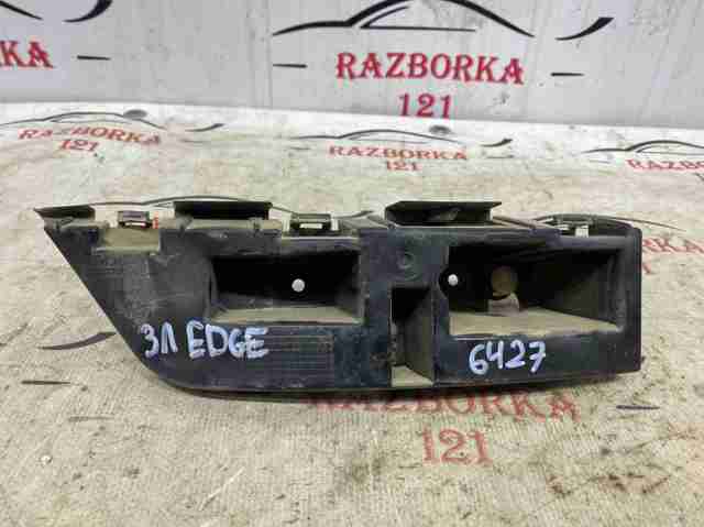 Ліве кріплення заднього бампера KT4Z17D943A FORD