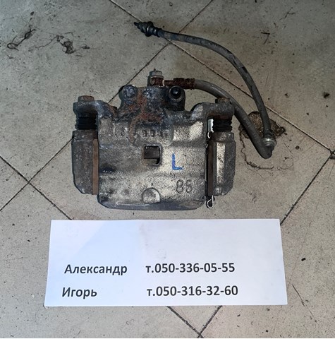 Супорт гальмівний, передній, лівий 41011JN00A NISSAN