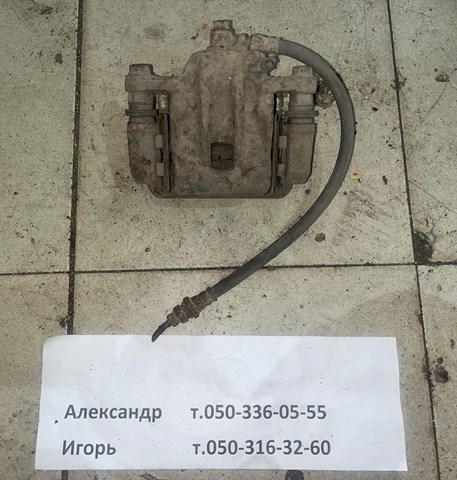 Задній гальмівний супорт лівий 582102E300 HYUNDAI