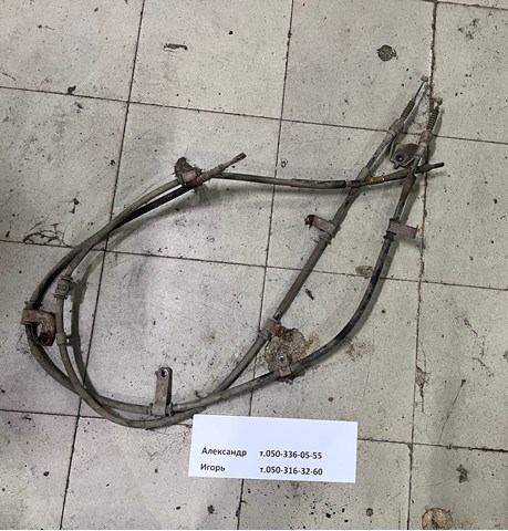 Трос ручного гальма задній, лівий 597602B500 HYUNDAI