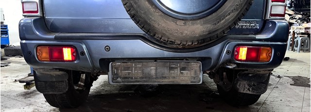 Кожух бампера заднього 7181165DD1799 SUZUKI